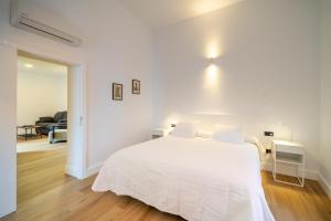 Postel nebo postele na pokoji v ubytování Albor Suites