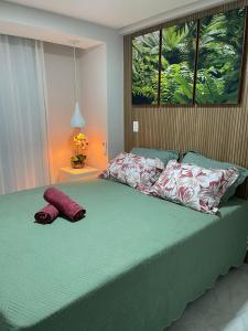Makambira Residence By SummerFlats no CENTRO DE PORTO DE GALINHAS tesisinde bir odada yatak veya yataklar