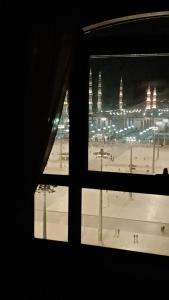 a view of a skating rink from a window at Al Aqeeq Al Rawda Hotel by Abu Al Joud in Al Madinah