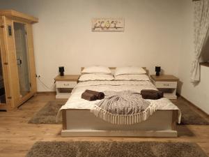 A bed or beds in a room at Kiscsermely Vendégház Még 37 kép