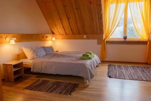 Postel nebo postele na pokoji v ubytování Ružas