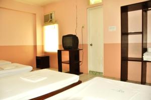 Letto o letti in una camera di GV Hotel - Lapu-Lapu City