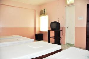 Letto o letti in una camera di GV Hotel - Lapu-Lapu City