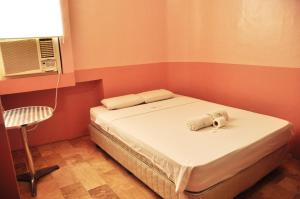 Letto o letti in una camera di GV Hotel - Lapu-Lapu City