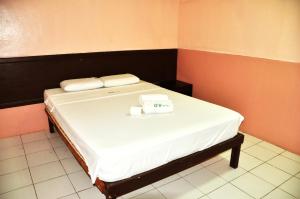 Letto o letti in una camera di GV Hotel - Lapu-Lapu City