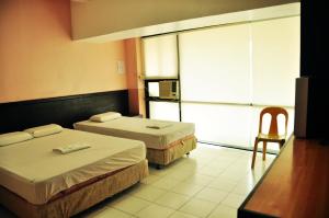 Letto o letti in una camera di GV Hotel - Lapu-Lapu City