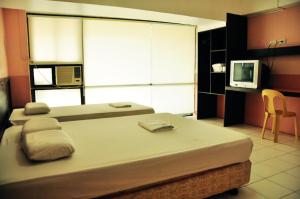 Postel nebo postele na pokoji v ubytování GV Hotel - Lapu-Lapu City