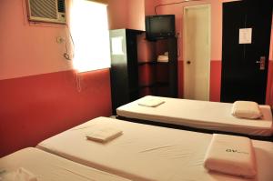 Letto o letti in una camera di GV Hotel - Lapu-Lapu City
