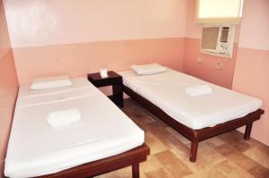 Letto o letti in una camera di GV Hotel - Lapu-Lapu City