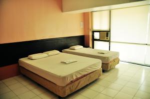 Letto o letti in una camera di GV Hotel - Lapu-Lapu City