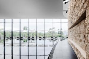 a view from the lobby of a building with glass windows at The Dolder Grand - City and Spa Resort Zurich in Zürich