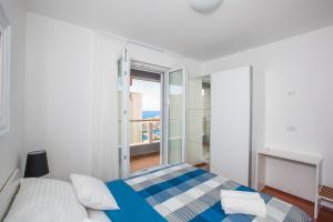 Posteľ alebo postele v izbe v ubytovaní 73 Stairs Apartment