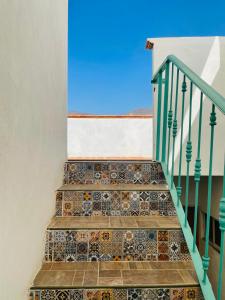 a set of stairs with tiles on them at Hostal Makea Pachuca in Pachuca de Soto