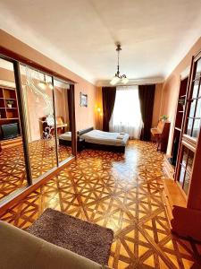 a large living room with a floor with at Apartments on Rynok Square in Lviv