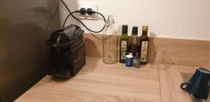 a group of bottles of wine sitting on a counter at 2 Appt 4 à 6 pers Val Louron au pied des pistes in Génos