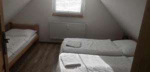 Posteľ alebo postele v izbe v ubytovaní Apartmán Jozef Valčianska dolina