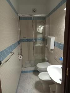 a bathroom with a shower and a toilet and a sink at Il Grillo Parlante in Castel Viscardo +3 photos