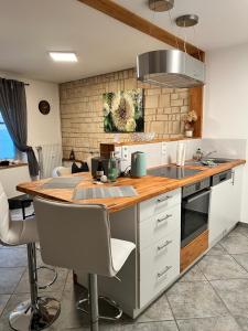 a kitchen with a kitchen island with a counter top at wohnbar-Apartment in Worbis