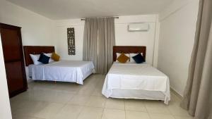 Tempat tidur dalam kamar di My Home Hotel Punta Cana