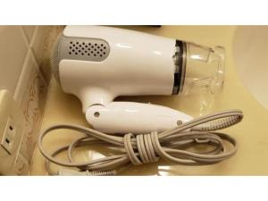 a hairdryer with a hair dryer at The QUBE Hotel Chiba - Vacation STAY 02227v in Chiba