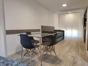 a dining room with a table and chairs in a room at RCT Club Vacacional & SPA in Chapadmalal