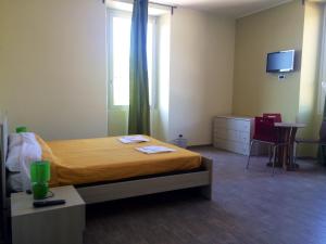 Postel nebo postele na pokoji v ubytování My Room Roma
