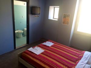 Postel nebo postele na pokoji v ubytování My Room Roma