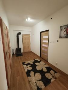 a living room with a black and white rug at Privat Teo Podtureň in Liptovský Mikuláš