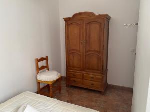 Łóżko lub łóżka w pokoju w obiekcie Casa Manolito