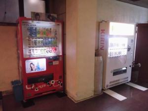 two vending machines sitting next to each other at Park Inn in Osaka