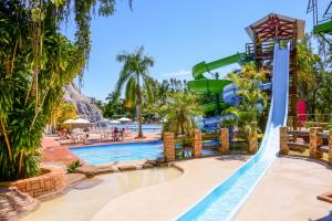 a water slide at a resort with a pool at Terra Parque Eco Resort in Noite Negra
