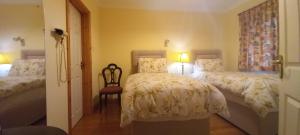 Postel nebo postele na pokoji v ubytování Woodhaven Manor h91rc9d