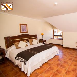 Postel nebo postele na pokoji v ubytování Hotel del Volcán