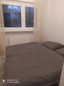 Cama o camas de una habitación en Apartament Brzechwy