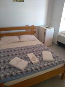 Ένα ή περισσότερα κρεβάτια σε δωμάτιο στο Pousada Maresias Guriri