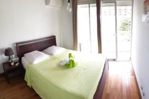 Postel nebo postele na pokoji v ubytování Le Lis Vacances et Affaire Cosy vue Mer