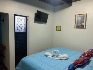 Postel nebo postele na pokoji v ubytování Hotel Clasico Colonial