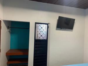 TV a/nebo společenská místnost v ubytování Hotel Clasico Colonial