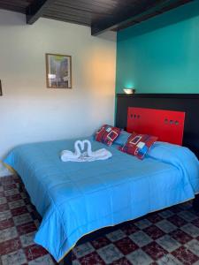Postel nebo postele na pokoji v ubytování Hotel Clasico Colonial