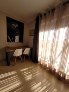 TV a/nebo společenská místnost v ubytování Ático Dúplex Baladrar Gran Terraza 8Km Playa Dénia-Oliva Nova Golf -IDEAL Familias y Grupos