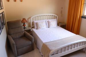 Ένα ή περισσότερα κρεβάτια σε δωμάτιο στο CASA DOS BONS VENTOS - À 6 minutos da praia de carro