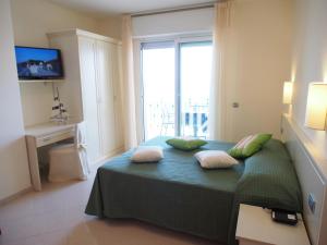 Кровать или кровати в номере Lido Resort