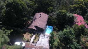 a small house in the middle of a forest at Tu casa de campo, Menus de la Montaña, te espera in Cerro Azul