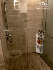 a shower with a glass door in a bathroom at Hill & Sea Balcony 1 Bedroom & 1 Living Room @Blu X in Bangsaen