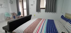 Postel nebo postele na pokoji v ubytování Yu Hai B&B