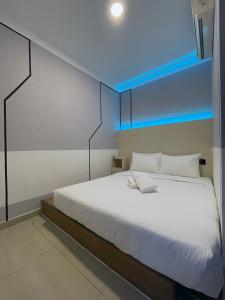 Postel nebo postele na pokoji v ubytování GG Hotel Bandar Sunway