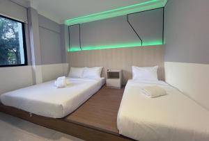 Postel nebo postele na pokoji v ubytování GG Hotel Bandar Sunway