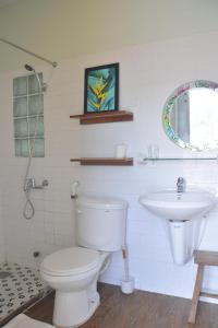 a bathroom with a toilet and a sink at Evangeline House in Da Lat