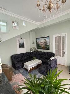 a living room with a couch and a table at Evangeline House in Da Lat