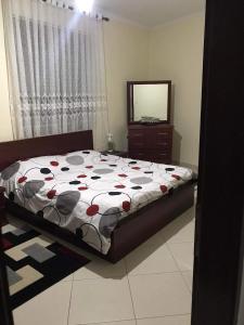 Giường trong phòng chung tại Vila Xhipe +13 ảnh